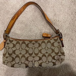 Coach small shoulder bag with water damage to strap